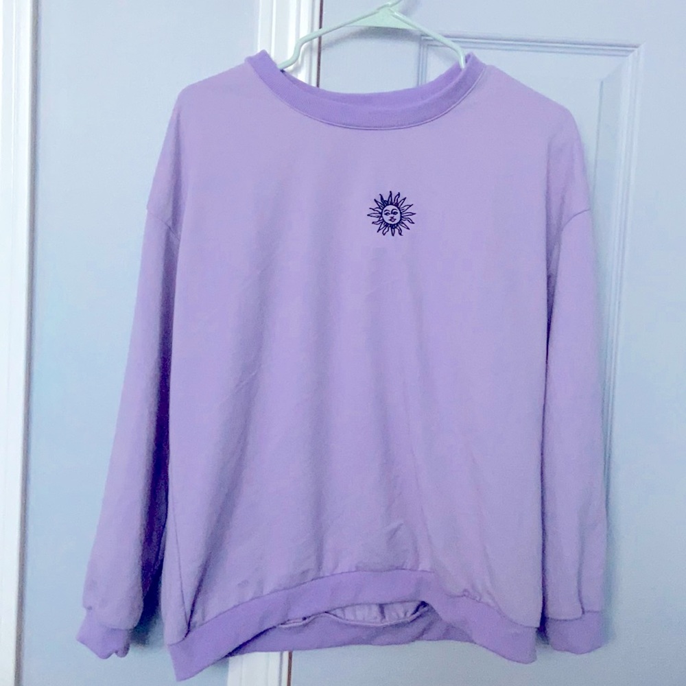 size medium purple sweatshirt with a sun on it